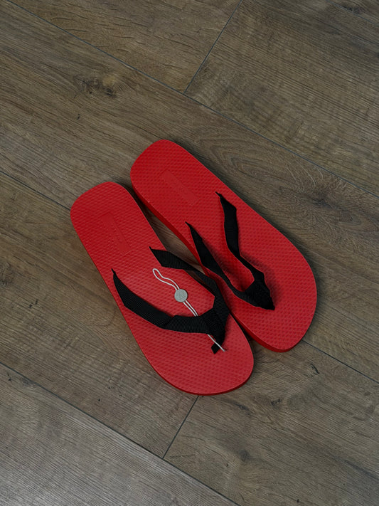 The Row red flip-flops